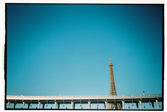 Abstract Paris architecture with tip of Eiffel Tower Bridge Bir-Hakeim