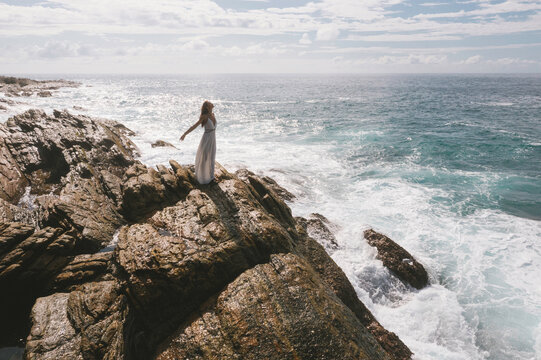 Romantic Bride, Brunette Girl in White Wedding Dress on Cliff Against