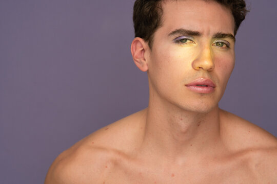 Male Model in Makeup Look Poses in Studio