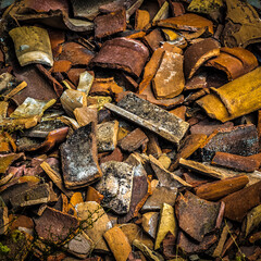 A bunch of shards of old pottery and jugs.