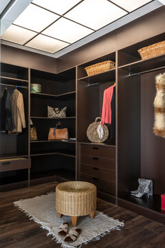 Interior of modern minimal wooden closet of luxurious residential home