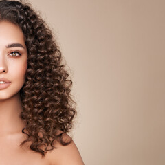 Fashion studio portrait of beautiful woman with afro curls hairstyle. Facial treatment....
