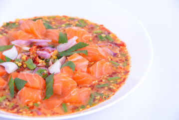 Spicy Salmon Salad on the white dish.