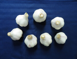 White garlic on blue cloth
