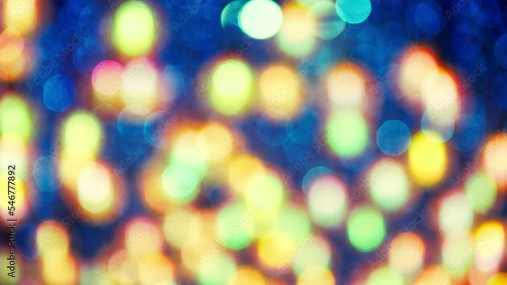 Poster blurred light spots seamless loop circle color bokeh lights background. defocused lens light