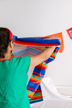 Woman preparing Day of the Dead altar