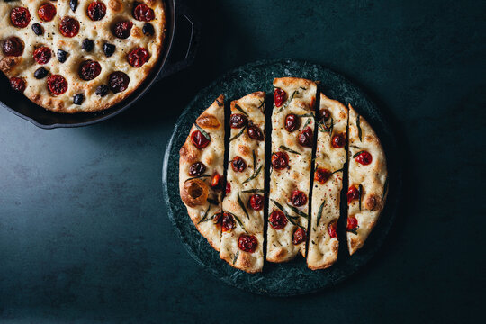 Italian focaccia with tomatoes and herbs