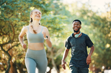 Running, fitness and fun with a diversity couple outdoor in the park together for exercise or a workout. Health, training and laugh with a male and female runner bonding together in cardio sports