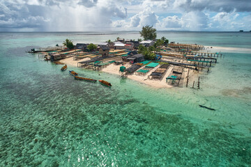 Boats harvest seaweed for drying, aerial drone - sustainable farming