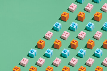 Pattern made from present gift boxes on green background