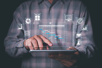 man analyst working with tablet in Business Analytics and Data Management System to make report...