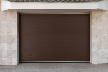 Brown modern counterweight garage doors on building