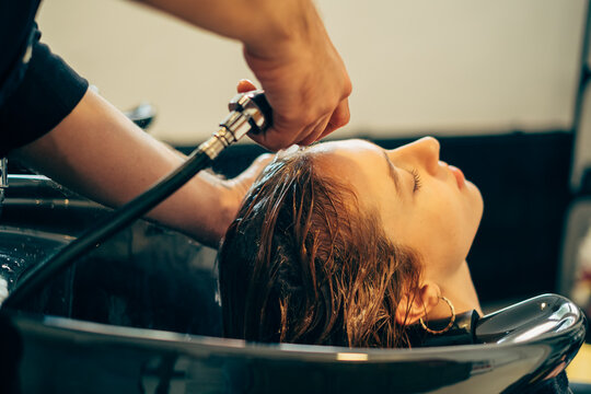 Hairdresser Washing Client's Hair