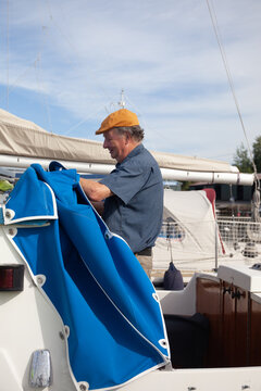Man prepares his boat to sail
