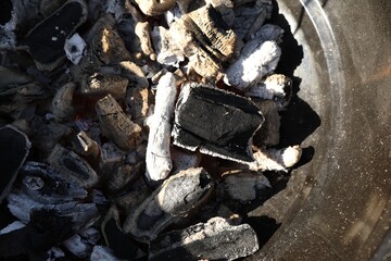 Barbecue grill with coals outdoors, top view