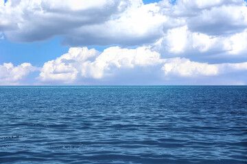 Obraz premium Beautiful view of seascape and blue sky with white clouds on sunny day
