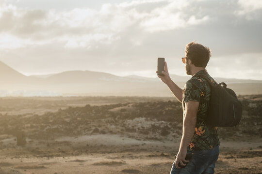 Anonymous traveler taking a photo with phone 