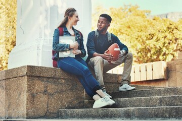 Students, friends and talking or bonding on university campus outside for knowledge and education. Woman, man and college student people conversation about schoolwork and sport or football