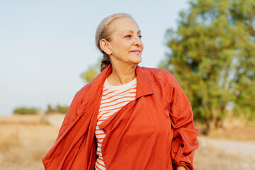 senior woman enjoying time by herself in nature