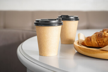 Paper cups with drink on table, closeup