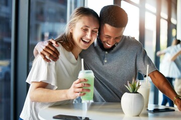 Dating, restaurant and couple with smoothie drink hugging, having fun and laughing together on...