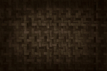 Old brown bamboo weave texture background, pattern of woven rattan mat in vintage style.