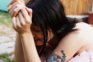 Young woman resting at green garden