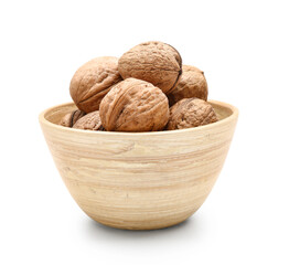 Bowl of fresh walnuts on white background
