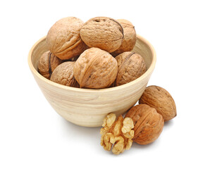 Bowl of fresh walnuts on white background