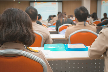 Soft focus Thai government officer from behind. blurred people background, Meeting Forum Conference...