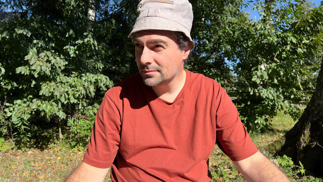 Low-angle view of a Mature man wearing a sun hat and terracotta 