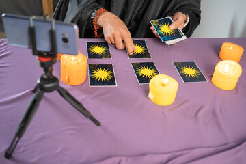 Fortune teller reading fortune lines on screen smartphone, online fortune telling application....