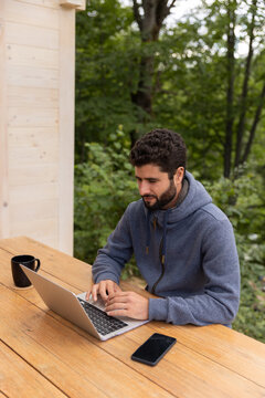 Man Working On His Laptop Outdoors