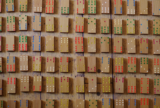 Wooden Dominoes laid out on a floor
