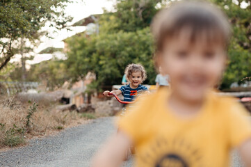 Children on bike in countryside.
