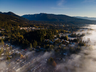 fog clinging to the North Shore mountains aerial - North Vancouver, BC