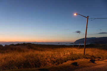 Oregon Coast landscape single Streetlight at sunset   