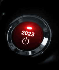 2023 new year push button with red glowing light. Trendy new year concept button design backdrop