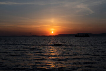 Naklejka premium Beautiful orange sunset over the sea with soft selective focus. Beauty of nature concept