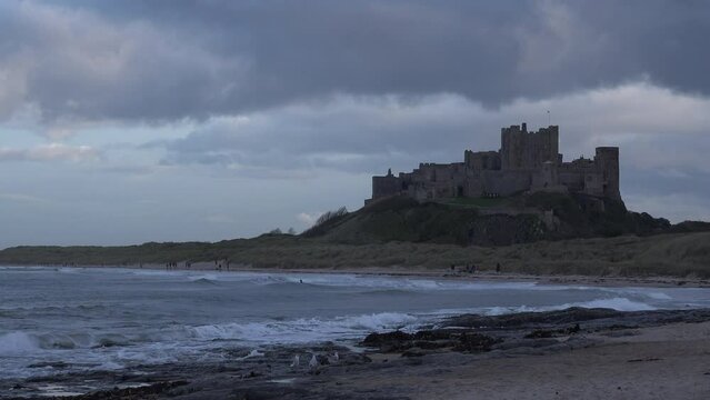 Bamburgh castle on the coast of Northumberland ancient building and tourist attraction on the East coast of England UK 4K