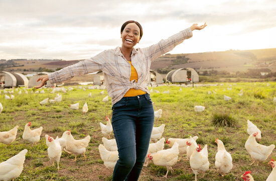 Winner, farm and chickens with a black woman agriculture worker in celebration while farming in the poultry industry. Farmer, motivation and countryside with a female agricultural expert outdoor