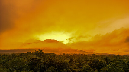 The Mountain Forest on Background of Sunset. Dramatic Sunset Sky