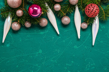 Composition with fir branches and Christmas decorations on color background