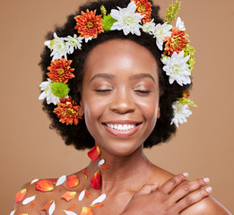 Hair flower, crown or beauty black woman with smile in brown studio background with glowing skin,...
