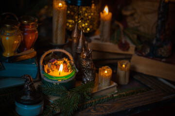 Illustration of magical stuff....candle light, magic wand, book of spells dark background, wizarding school, mystical aesthetic