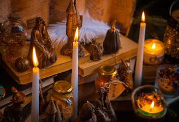 Illustration of magical stuff....candle light, magic wand, book of spells dark background, wizarding school, mystical aesthetic