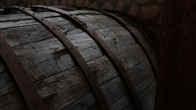 Oak barrels in underground wine cellar. Wine Barrels in Italy