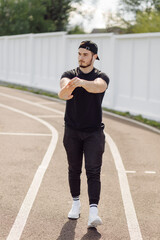 Fototapeta na wymiar Male athlete doing fitness training. Workout outside the gym.