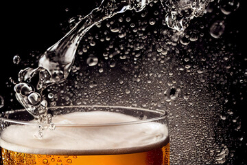 a glasses of beer splash on black background