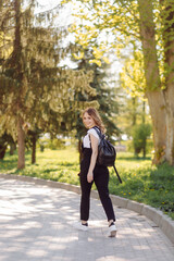 Portrait of young beautiful attractive woman at summer green park